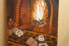 У камина.